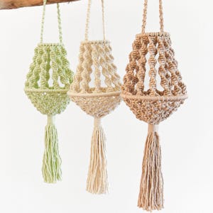 May include: A set of three ceramic mugs with a speckled, matte finish. The mugs are in shades of cream, light gray, and dark gray. Each mug has a simple, minimalist design, perfect for coffee or tea.