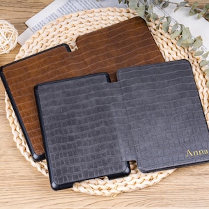 Close-up of gold foil embossed initials on crocodile leather Kindle cover