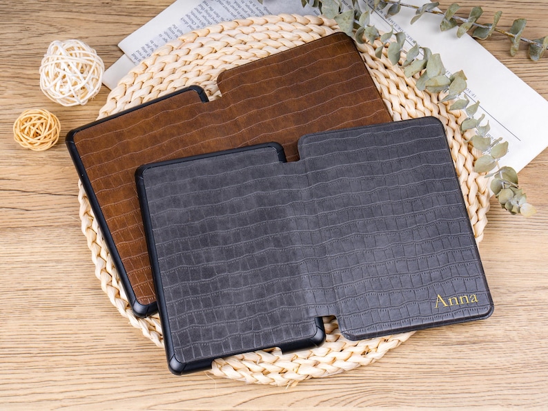 Close-up of gold foil embossed initials on crocodile leather Kindle cover