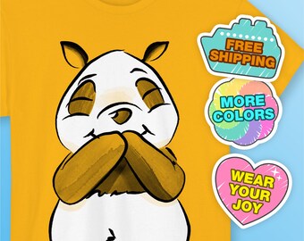 May include: A mustard yellow t-shirt featuring a graphic illustration of a panda with closed eyes and brown paws. The shirt includes three circular badges with the text: FREE SHIPPING, MORE COLORS, and WEAR YOUR JOY in various colors and fonts.
