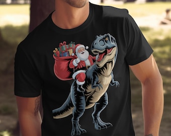 Kerstman rijdt op dinosaurus, png PNGEgg | Grappige kerstsublimatie | T-rex kerstman clipart | Ontwerp vakantieshirt afdrukbaar