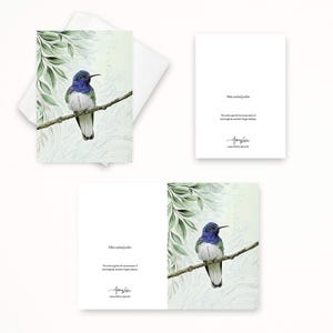 May include: Greeting cards featuring a watercolor illustration of a white-necked jacobin hummingbird perched on a branch. The bird has blue, white, and green plumage. The cards include the text "White-necked Jacobin" and support hummingbird conservation.