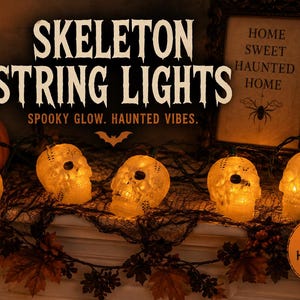 May include: A string of illuminated skull-shaped lights with a warm glow. The text SKELETON STRING LIGHTS, SPOOKY GLOW. HAUNTED VIBES., HOME SWEET HAUNTED HOME, and PERFECT FOR HALLOWEEN DECOR is visible alongside a pumpkin and a framed sign.