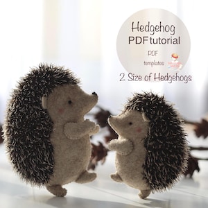 May include: Two handmade felt hedgehogs with brown and beige coloring. The hedgehogs have dark brown spines and small, black eyes. The image includes text that reads "Hedgehog PDF tutorial" and "2 Size of Hedgehogs".
