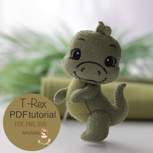 May include: A handmade green felt T-Rex dinosaur toy with a friendly expression. The dinosaur has black embroidered details and a small tail. The image includes a circular graphic with the text "T-Rex PDF tutorial" and template details.