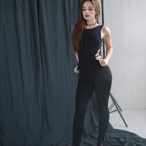 Black stretch catsuit for women – sleeveless bodycon jumpsuit with open neckline and tight legs, festival stage rave club performance outfit