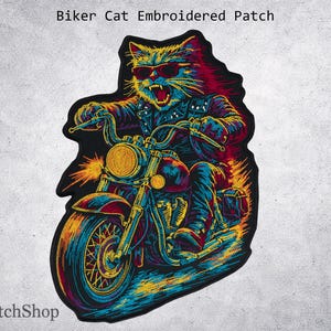 May include: A colourful embroidered patch depicting a cat in sunglasses and a leather jacket riding a motorcycle. The patch features text at the top reading "Biker Cat Embroidered Patch". The design uses shades of blue, yellow, red, and black.