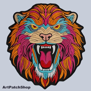 May include: A colourful embroidered patch depicting a lion's face with a fierce expression. The lion has orange, pink, blue and white fur. The patch is ideal for adding a bold statement to clothing, bags or other accessories.