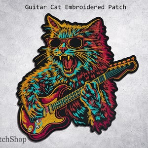 May include: Embroidered patch featuring a colorful cat wearing sunglasses and playing an electric guitar. The cat is depicted with vibrant hues of yellow, red, blue, and black. Text at the top reads "Guitar Cat Embroidered Patch".