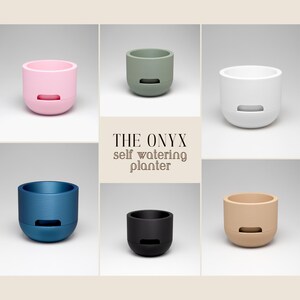 May include: A collection of six self-watering planters in various colors, including pink, green, white, blue, black, and beige. Each planter has a rounded base and a rectangular opening near the bottom. The text "THE ONYX self watering planter" is displayed.