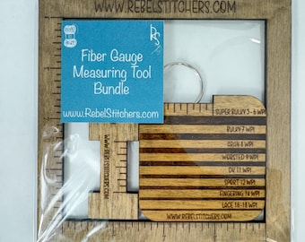 May include: A wooden fiber gauge measuring tool bundle with a key ring. The tool includes a ruler with markings for different yarn weights, including super bulky, bulky, aran, worsted, dk, sport, fingering, and lace. The tool is labeled with the website "www.rebelstitchers.com".