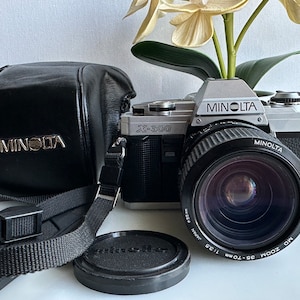 Minolta X-300 35 mm film SLR camera with Minolta MD 1:3.5 35-70 mm lens