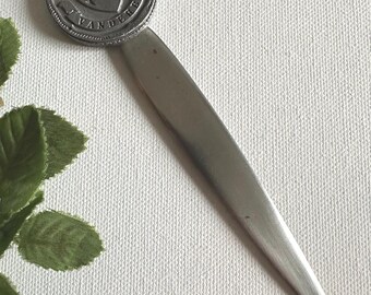 A vintage Vanderbilt University letter opener, issued for the centennial in 1973