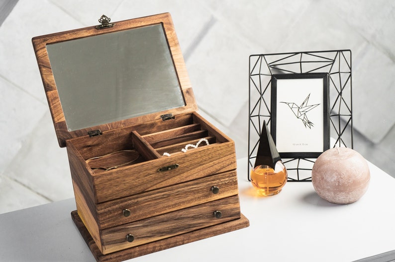 Walnut Jewelry Box with drawers and separated compartments for small things. Integrated mirror in wood lid.