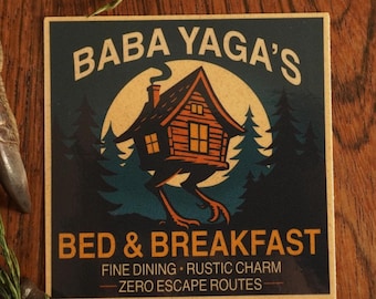 May include: Square sign with the text "BABA YAGA'S BED & BREAKFAST" featuring a cabin on chicken legs, set against a forest and moon backdrop. The sign also reads "FINE DINING • RUSTIC CHARM - ZERO ESCAPE ROUTES."