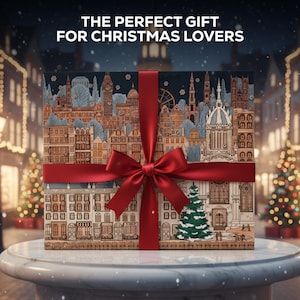 Op de afbeelding: Een cadeauverpakking met een rood lint en strik, met een gedetailleerde illustratie van een Europese stadsgezicht. De doos is versierd met gebouwen, bomen en een kerstthema. Tekst op de doos luidt: "THE PERFECT GIFT FOR CHRISTMAS LOVERS."