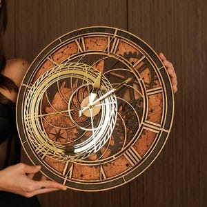 May include: A circular wooden wall clock featuring a complex layered design with dark and light wood tones. The face displays Roman numerals, intricate gear cutouts, and gold-colored hands. The text CLOCK TOWER HOGWARTS is engraved at the top.