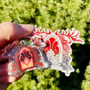 Bundle of Alastors radio keychain with Alastors Radio sticker transparent