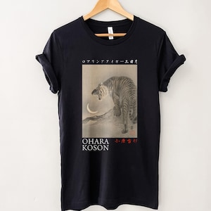 May include: Black t-shirt with a graphic print of a tiger roaring under a crescent moon. The text "OHARA KOSON" and Japanese characters are printed below the image.