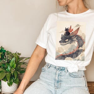 Black Cat Riding a Dragon T-Shirt | Fun Fantasy T-Shirt | Kawaii Cat Lover Gift | Unique Cat and Dragon Design | Casual Anime Tee