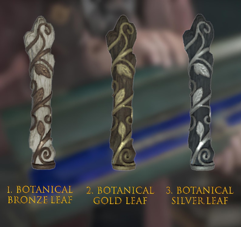 May include: Three decorative wooden finials with a leaf design. The finials are painted in bronze, gold, and silver.