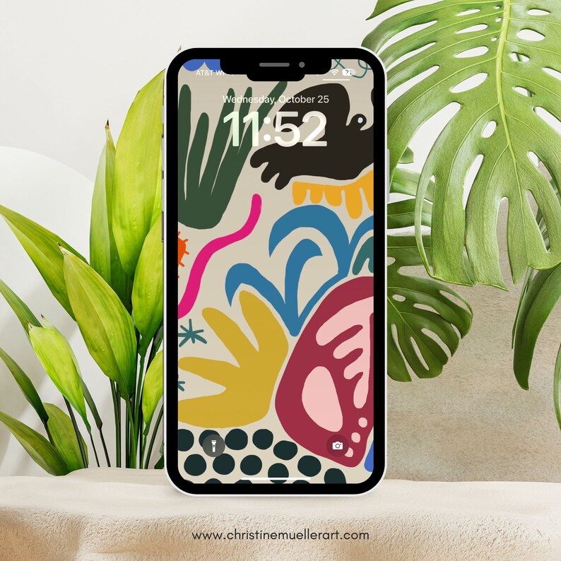 Puede incluir: Un fondo de pantalla de tel&eacute;fono abstracto colorido con un fondo beige. El fondo de pantalla presenta una variedad de formas y colores, incluyendo verde, azul, amarillo, rosa y rojo. La hora se muestra en la pantalla del tel&eacute;fono como 11:52.