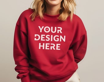 May include: A red sweatshirt with the text "YOUR DESIGN HERE" printed in white on the front.