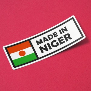 May include: A white sticker with the text "Made in Niger" and the flag of Niger. The flag is orange, white, and green with a circle in the centre.