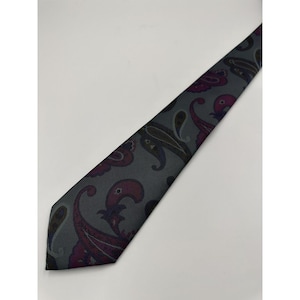 May include: A gray paisley patterned tie with pink, purple, and green accents.