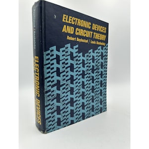 May include: A blue and black book with the title "Electronic Devices and Circuit Theory" by Robert Boylestad and Louis Nashelsky. The cover features a repeating pattern of blue and black geometric shapes.