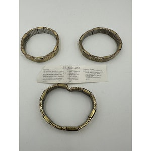May include: Three gold and silver magnetic bracelets with instructions on a white card. The instructions say the bracelets can stimulate blood circulation, improve blood circulation, and relieve stiffness.