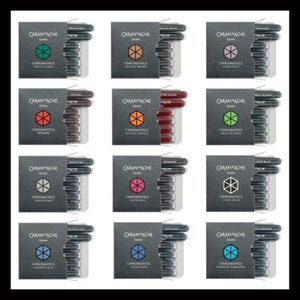 May include: Twelve Caran d'Ache Chromatics ink cartridge sets in various colors, including Vibrant Green, Organic Brown, and Electric Orange. Each set is in a gray box with the Caran d'Ache logo and color name. The sets are arranged in a grid.