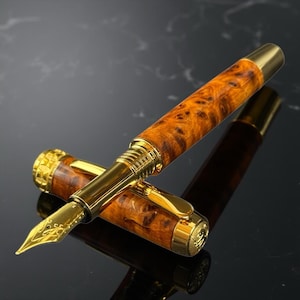 Op maat gemaakte exotische Thuya Burl Wood Gold-vulpen: een pen die net zo uniek is als jouw verhaal