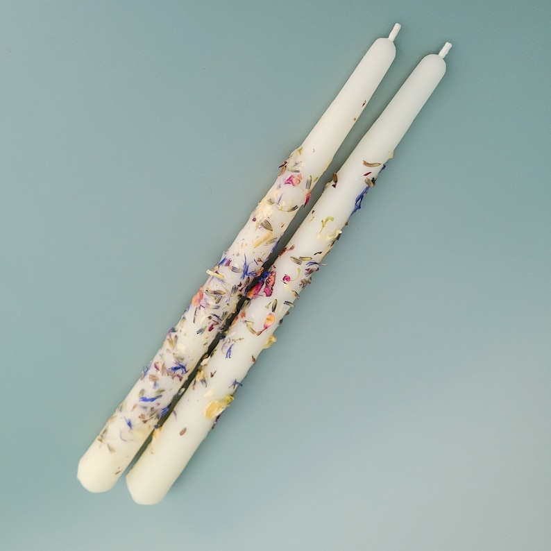 Handmade Beeswax Candle Taper with a Pure Cotton Wick with Rose Petals, Jasmine Flowers, Lavender Buds, and Cornflower adorning the candle. This is our Goddess variant.