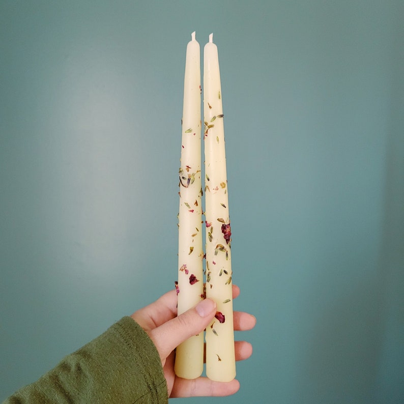 Handmade Beeswax Candle Taper with a Pure Cotton Wick with Rose Petals and Lavender Buds adorning the candle. This is our Lavender and Rose variant.