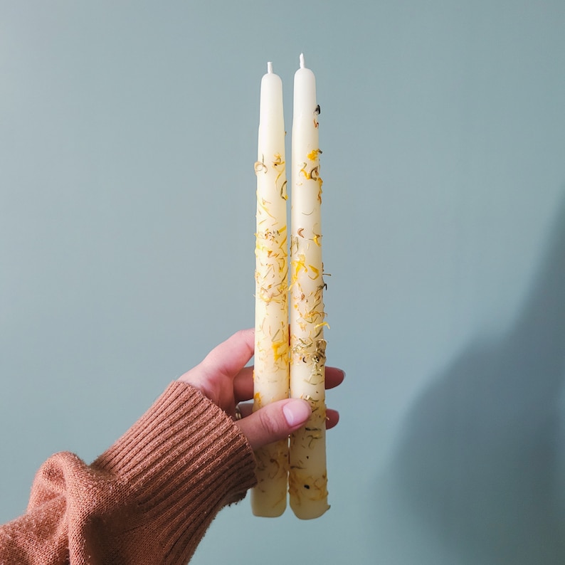 Handmade Beeswax Candle Taper with a Pure Cotton Wick. Candles are adorned with calendula flower petals. This is Happy Little Herbs Calendula variant.