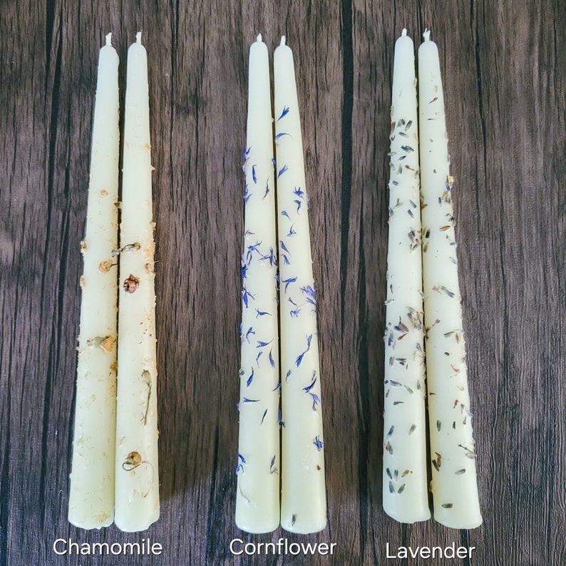 Handmade beeswax candles with chamomile, cornflowers and lavender flowers