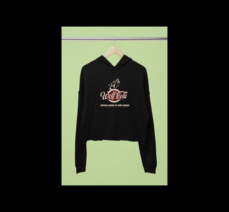May include: Black cropped hoodie with a red and white logo that says "Wolf Cola" and "Official Drink of Bokob Haram".