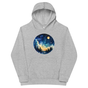 May include: A grey hoodie with a circular design featuring a watercolour painting of a night sky with a full moon, stars, and a silhouette of trees.