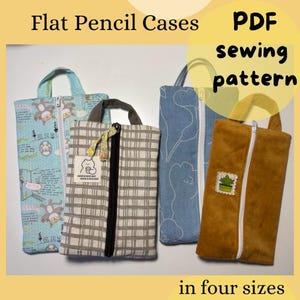 May include: Four flat pencil cases in various fabrics, each with a zipper closure and a handle. The cases are in different colors and patterns, including a light blue with a cartoon design, a gray plaid, a blue floral, and a brown suede-like material. Text reads "Flat Pencil Cases" and "PDF sewing pattern in four sizes."