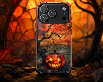 May include: A rectangular smartphone case featuring a stained-glass style design of a glowing jack-o'-lantern sitting beneath a dark tree. The background displays a vibrant orange and red sunset sky with a cracked glass texture and black camera lenses.