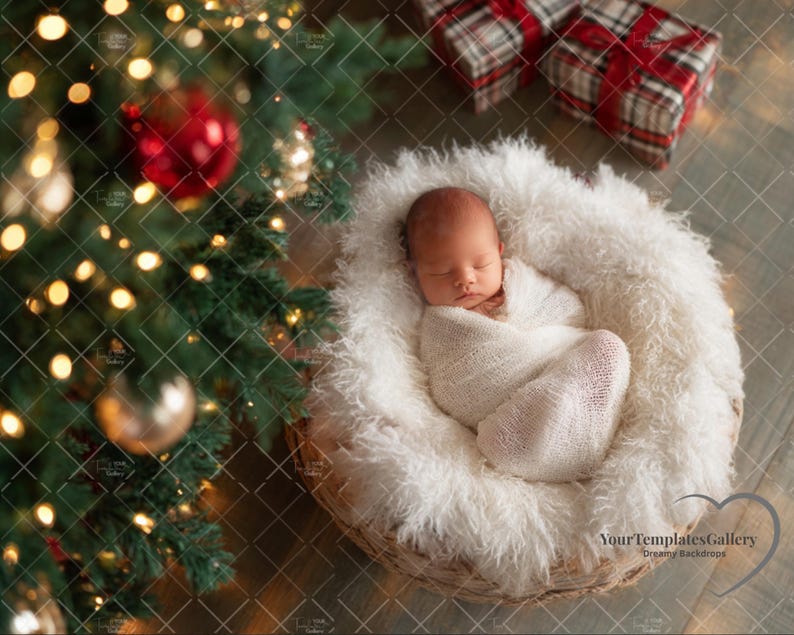 May include: A newborn baby wrapped in a white blanket, nestled in a fluffy, white, woven basket. The basket is on a wooden surface, with a Christmas tree and wrapped gifts in the background. The scene is lit with warm, soft lighting.