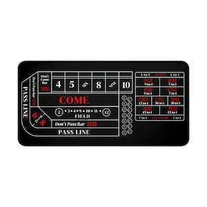 May include: A black craps table mat with white and red text. The mat features areas for betting, including "PASS LINE," "COME," and "FIELD." Numbers 4, 5, 6, 8, 9, and 10 are displayed. The mat is rectangular.
