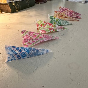 Dum dum wrapper paper airplanes