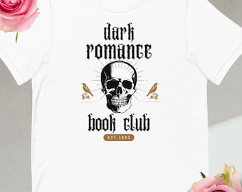 May include: White t-shirt with a black skull and crossbones graphic. The text "dark romance book club est. 1993" is printed below the skull.