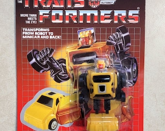 Tapacubos Transformers G1, vendedor estadounidense, MOSC. ¡Raro! Minibot de juguete remake de Autobot.