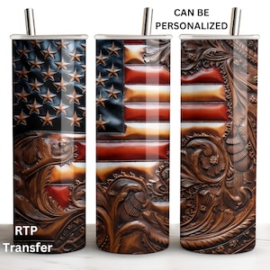 May include: A stainless steel tumbler with a design featuring the American flag. The flag design has a leather texture with embossed stars and stripes in shades of brown, red, and blue. The tumbler includes a silver straw and the text "CAN BE PERSONALIZED" and "RTP Transfer".