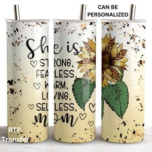 May include: A stainless steel tumbler with a white background and a sunflower graphic. The tumbler has a black and gold speckled design and text that reads "She is strong, fearless, warm, loving, selfless, mom".