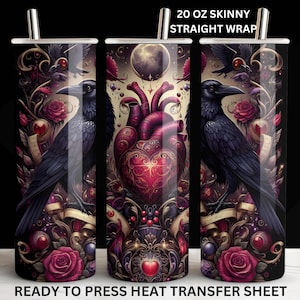 May include: A 20 oz skinny straight wrap with a gothic design. The wrap features a black raven, a human heart, roses, and ornate scrollwork in shades of red, purple, and gold. The text "READY TO PRESS HEAT TRANSFER SHEET" is at the bottom.