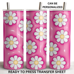 May include: Three stainless steel tumblers with a pink background and white daisy pattern. The tumblers are ready to be personalized.  CAN BE PERSONALIZED. READY TO PRESS TRANSFER SHEET.